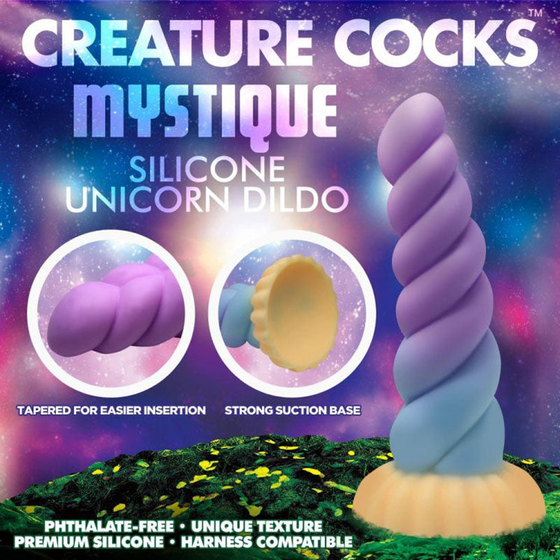 Introducing the Creature Cocks Mystique Silicone Unicorn Dildo - a 21 cm fantasy dildo in mystical purple and blue. Made from premium, phthalate-free silicone, its twisted spiral design offers unique texture and includes a robust suction cup base, making it harness compatible for an exceptional experience.