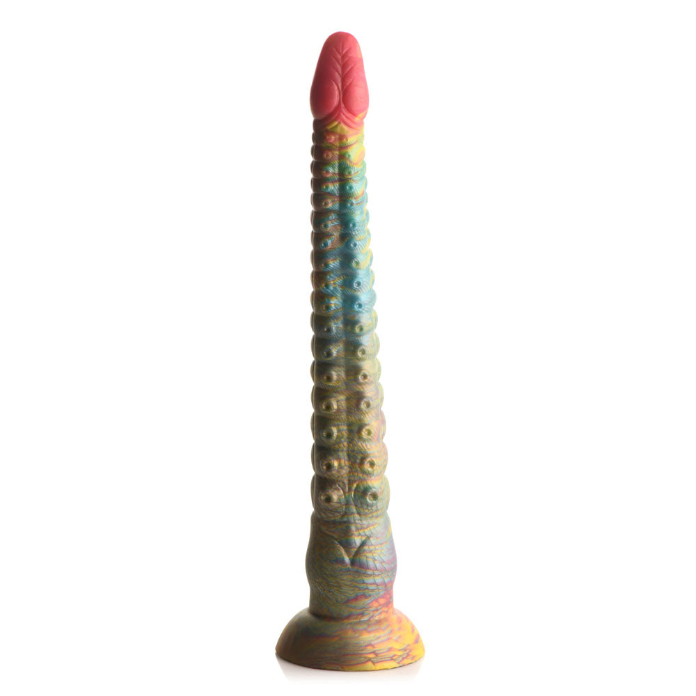 The Creature Cocks Tenta-Dick is a 32 cm multicolored tentacle fantasy dildo with a pink, flower-like textured top. Its shaft displays a gradient of blue, green, and yellow with circular patterns and features a wide suction-cup base made from phthalate-free silicone.