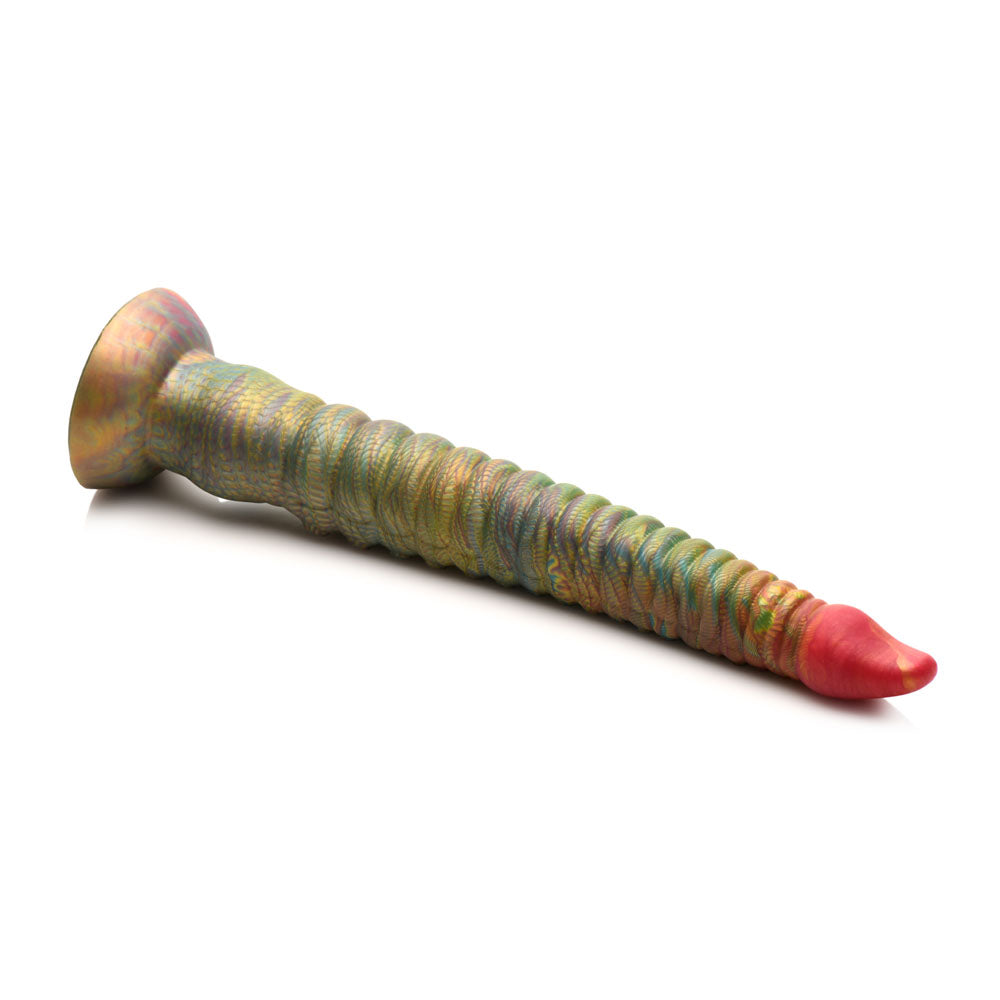 The Creature Cocks Tenta-Dick is a 32 cm tentacle fantasy dildo featuring a multicolored, spiral-textured phthalate-free silicone design. It has a wide suction-cup base, tapers to a pointed red tip, and blends green, gold, and pink hues with a metallic sheen on its unique ridged surface.