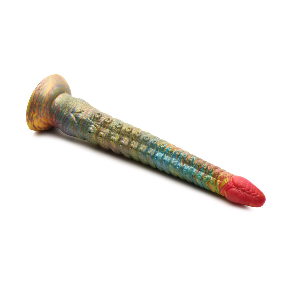 The Creature Cocks Tenta-Dick is a multi-colored 32 cm tentacle fantasy dildo with a vibrant, textured silicone design featuring intricate patterns in green, blue, and red. It has a detailed ridged surface, suction-cup base, and is made from phthalate-free silicone for safe use.