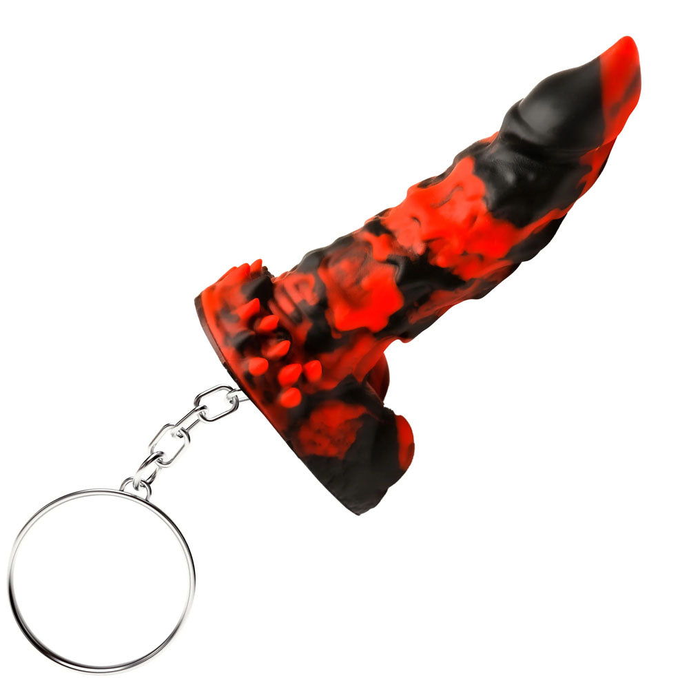 The Creature Cocks Fire Demon Keychain is a playful, abstract mini rocket-shaped accessory made from body-safe silicone in red and black marbled hues. Its chain and circular ring enhance its dynamic design, making it ideal for fantasy roleplay enthusiasts.