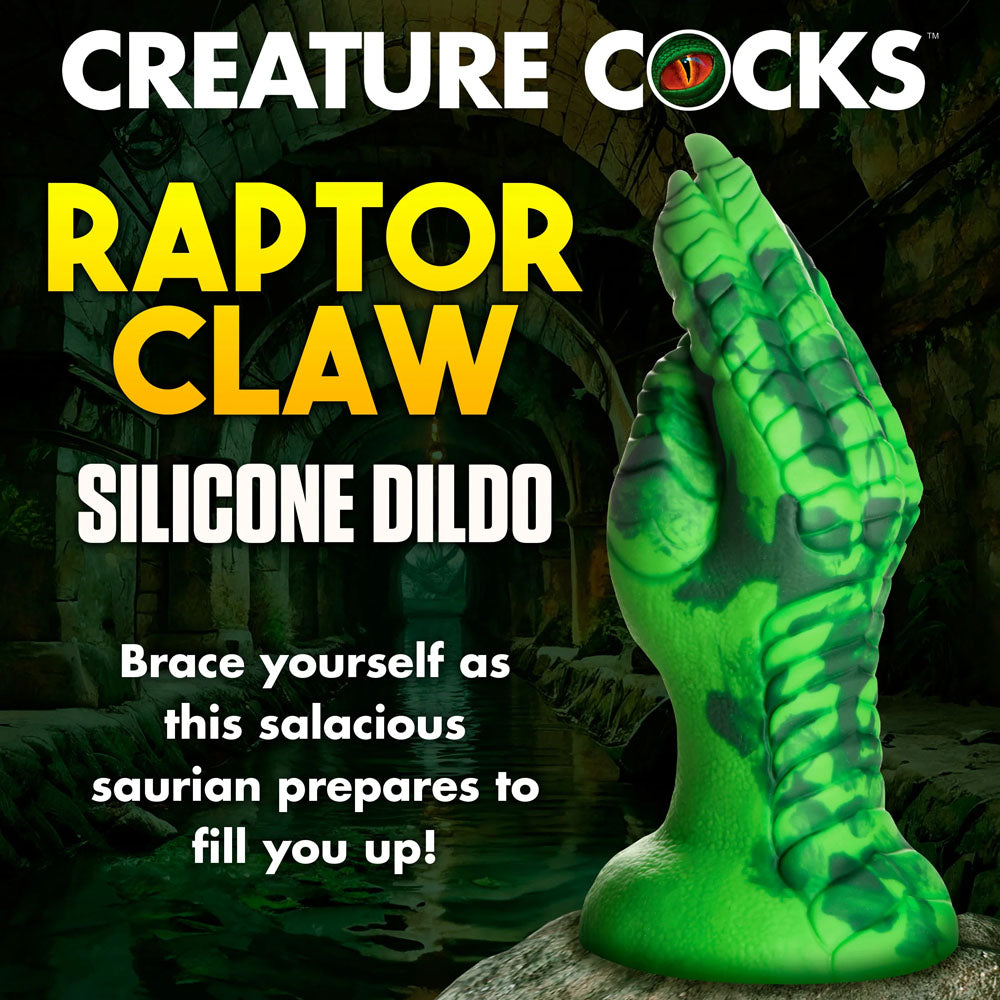 A green silicone dildo shaped like a raptor claw with scales and talons, set against a dark backdrop, reads CREATURE COCKS RAPTOR CLAW SILICONE DILDO. Dive into fantasy roleplay with the Creature Cocks Raptor Claw Fisting Silicone Dildo - Green 21.8 cm Claw Fantasy Dildo!.