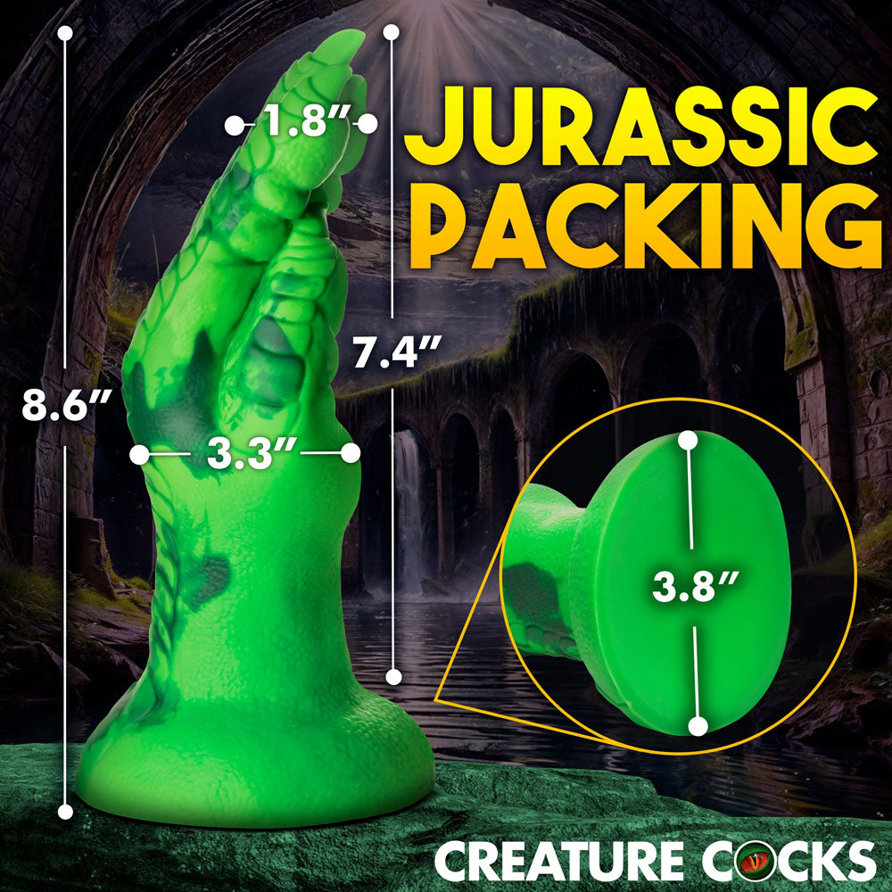 The bright green Creature Cocks Raptor Claw Fisting Silicone Dildo is displayed against a dark backdrop. Its dinosaur-themed design adds to the roleplay allure. Measurements are 21.8 cm tall, 7.9 cm wide at the tip, and 9.6 cm at the base with bold text: JURASSIC PACKING.