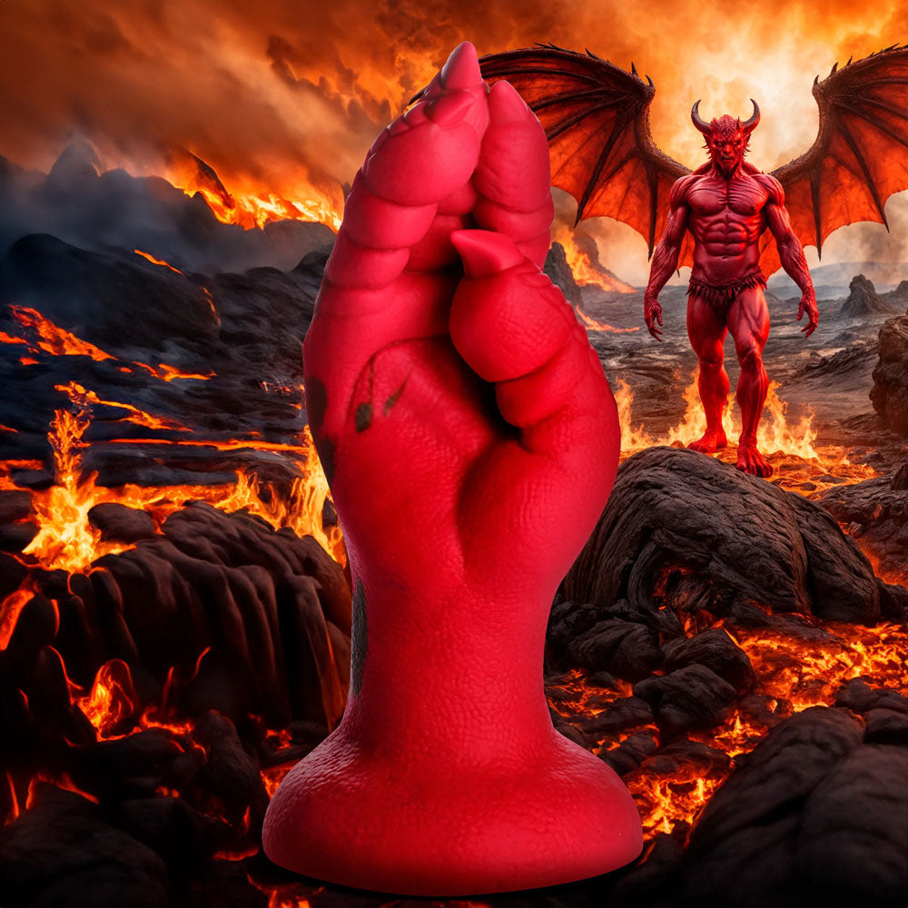 A red Creature Cocks Demon Claw Fisting Silicone Dildo creates a striking fist in the foreground, while a bat-winged creature looms over a fiery volcanic scene. The sky glows orange and red, with molten lava weaving through the ground, setting an intense fantasy roleplay atmosphere.