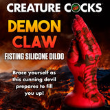 A red and black claw-shaped silicone dildo is set against a fiery background. Text reads: “Creature Cocks Demon Claw Fisting Silicone Dildo - Red 21.8 cm Claw Fantasy Dildo. Embrace fantasy roleplay with this demonic hand design as the cunning devil prepares to fill you up!”.