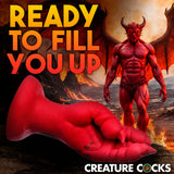 A muscular, red demon with horns and wings stands in a fiery landscape. Above a red, textured fantasy-themed item is bold yellow text: READY TO FILL YOU UP. CREATURE COCKS appears at the bottom in white. Product: Creature Cocks Demon Claw Fisting Silicone Dildo - Red 21.8 cm Claw Fantasy Dildo.
