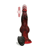 The Alien Nation - Fire Dragon is a red and black 22.9 cm textured dong shaped like an animal paw, crafted from body-safe silicone with a swelling base and tapered tip. It includes a black remote with three buttons for thrusting and vibrating, boasting the text Thrusts & Vibrates! nearby.
