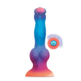 The Alien Nation Glo-Spot is a 21.6 cm glow-in-the-dark fantasy dong in vibrant blue, purple, and pink. Its starry tentacle design features a bulbous base, tapered tip, circular power emblem, and intense vibrations with USB rechargeability.