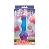 The Alien Nation Glo-Spot package showcases a 21.6 cm glow-in-the-dark fantasy-themed vibrating dong, with vibrant blue and pink colors set against an abstract alien landscape. It features 100% Silicone and 100% Fantasy, offering powerful USB-rechargeable vibrations.