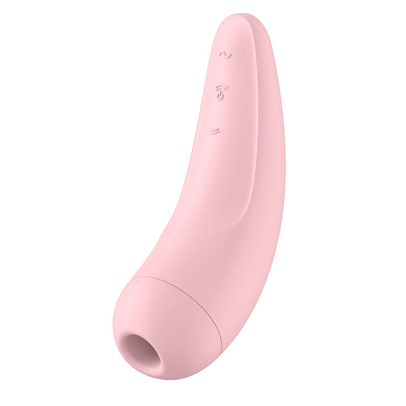 The Satisfyer Curvy 2+ is a sleek, pink, curved handheld clitoral stimulator featuring Air Pulse technology and a matte finish. It has a cylindrical body with a rounded tip and small circular opening. Embossed controls are compatible with the Satisfyer Connect App for enhanced functionality.