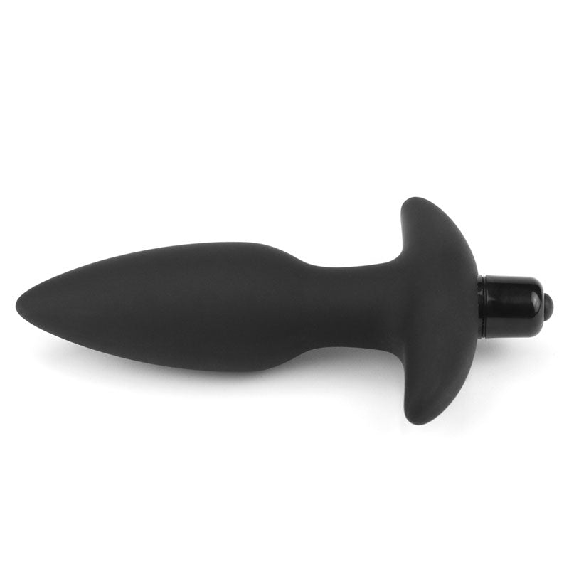 The Anal Indulgence Collection Silicone Fantasy Anal Plug - Black 14.5 cm Vibrating Butt Plug features a black silicone body with a tapered tip and flared base on a white background, highlighting its vibrating feature with an embedded cylindrical bullet for comfort and safety.