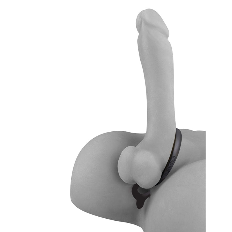 A minimalist grayscale image of the Anal Fantasy Ass-Gasm, featuring a phallic design against a white background. Crafted from elite silicone, it includes stylized male genitalia with a thin black band and is accented by a small heart-shaped pendant.