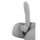 A minimalist grayscale image of the Anal Fantasy Ass-Gasm, featuring a phallic design against a white background. Crafted from elite silicone, it includes stylized male genitalia with a thin black band and is accented by a small heart-shaped pendant.