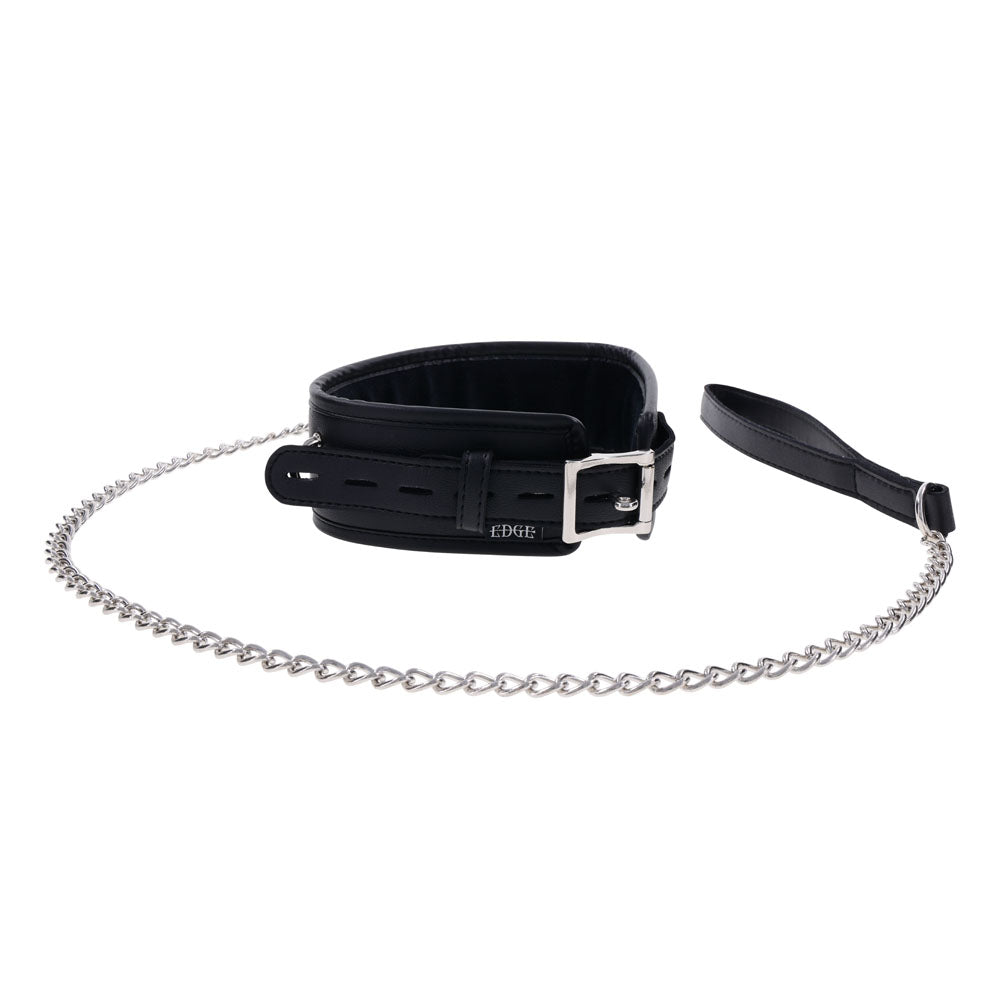 The EDGE Collar & Leash set includes a sleek faux leather collar with EDGE inscribed and a silver buckle, paired with a heavy-duty silver chain leash ending in a black leather loop handle. These striking items are showcased against a pristine white background.