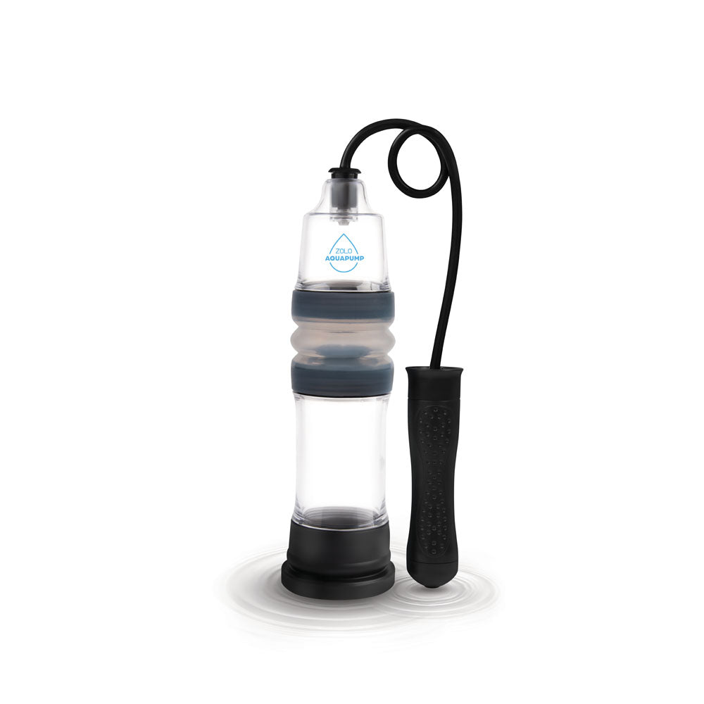 The Zolo Aquapump Auto Pro - Clear Auto Water Penis Pump boasts a transparent design with a black handle and tubing. Its cylindrical body features a flexible middle section and is equipped with a blue sealing ring near the top, enhanced by its waterproof construction on a circular black base.