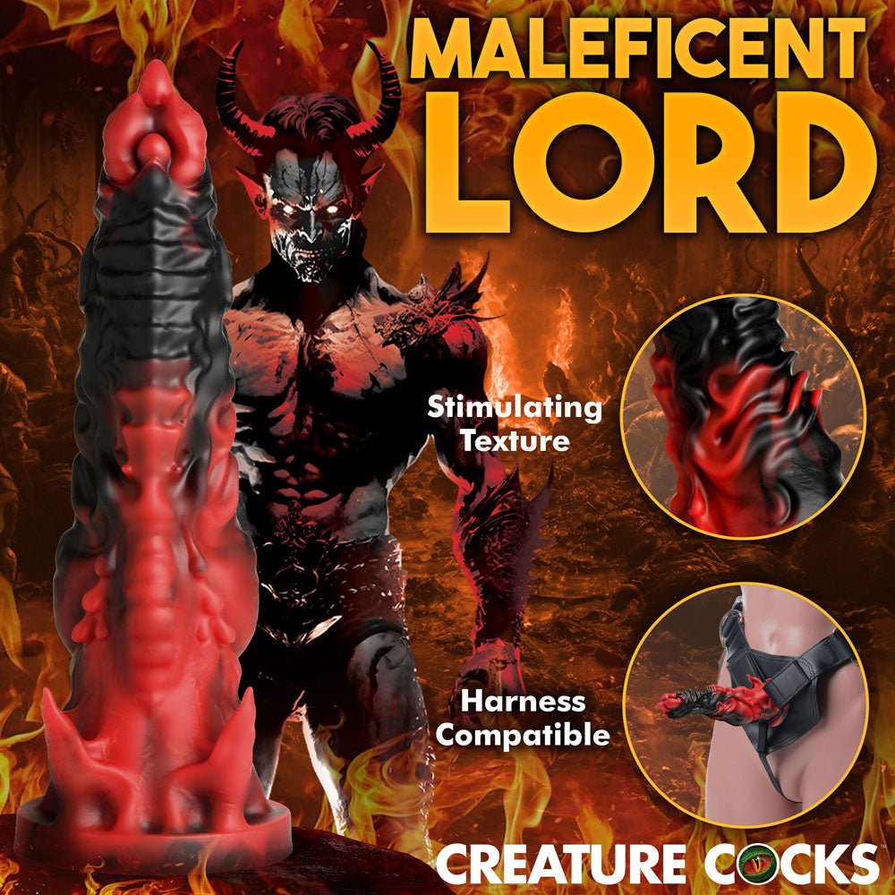 The Creature Cocks Mephisto fantasy-themed dildo, measuring 18.5 cm, is showcased with a demonic horned figure against flames. Maleficent Lord text highlights its Stimulating Texture and Harness Compatible features. Made from premium silicone, it displays use in a strap-on harness.