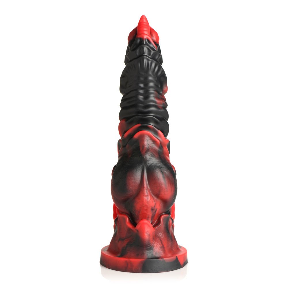 The Creature Cocks Mephisto, a red and black fantasy-themed dildo, is crafted from premium silicone. It features a textured, ridged surface with intricate details, stands upright on a flat base, and exudes an artistic and imaginative aesthetic. Length: 18.5 cm.