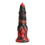 The Creature Cocks Mephisto, a red and black fantasy-themed dildo, is crafted from premium silicone. It features a textured, ridged surface with intricate details, stands upright on a flat base, and exudes an artistic and imaginative aesthetic. Length: 18.5 cm.