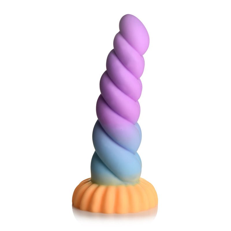The Creature Cocks Mystique 21 cm Fantasy Dildo resembles a unicorn horn, crafted from premium silicone with a smooth matte finish. It features a multicolored spiral design transitioning from purple at the tip to a yellow base with textured edges and includes a suction cup for versatile use.