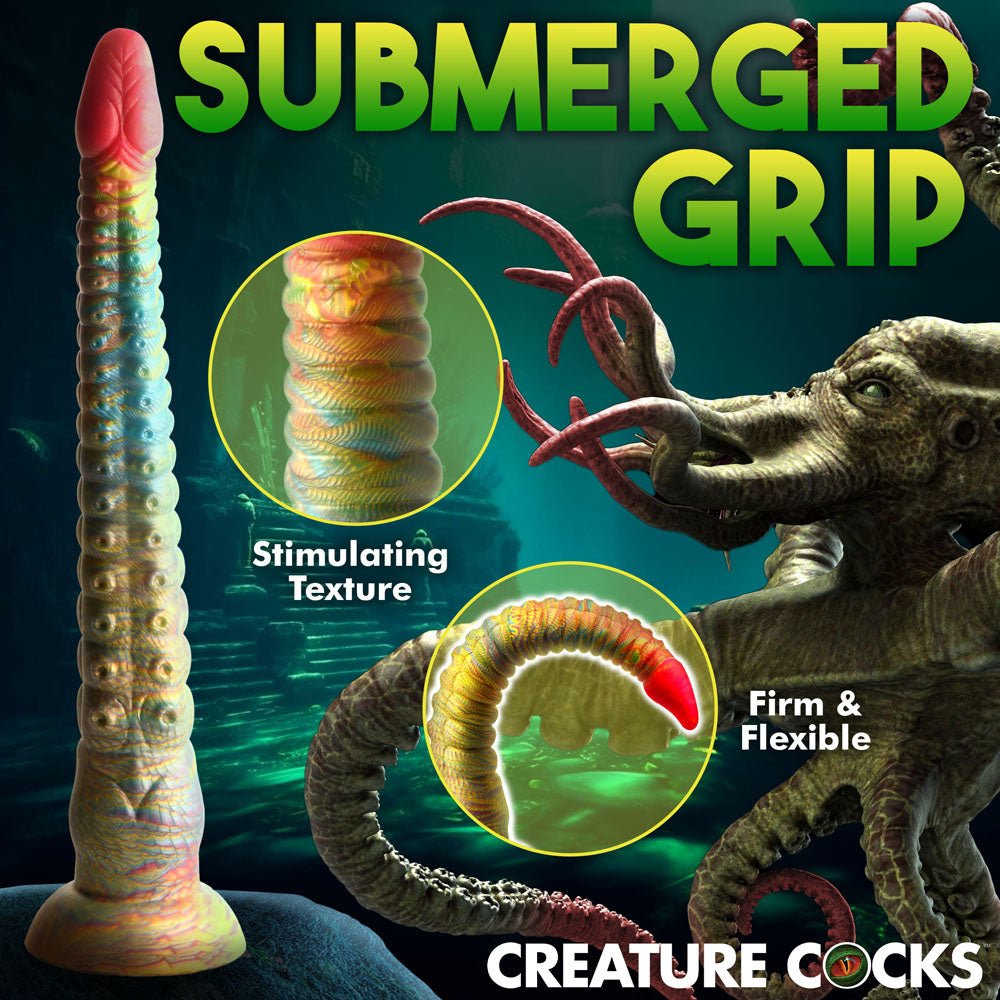 Creature Cocks promotional image Submerged Grip presents the 32 cm Tenta-Dick tentacle dildo, made of phthalate-free silicone. It features a detailed creature design in an underwater setting, highlighting its stimulating texture and firm yet flexible properties against a dark, aquatic background.