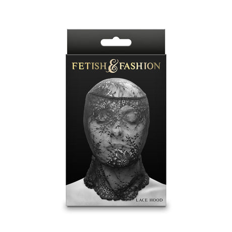 The Fetish & Fashion - Lace Hood - Black - Black Hood comes in packaging that showcases a mannequin head wearing an elegant stretch lace hood. The intricate black lace covers the face and neck gracefully, with a stylish black and white palette highlighting the product name at the bottom.